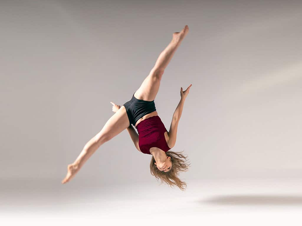 Dancer practicing aerial and acro control