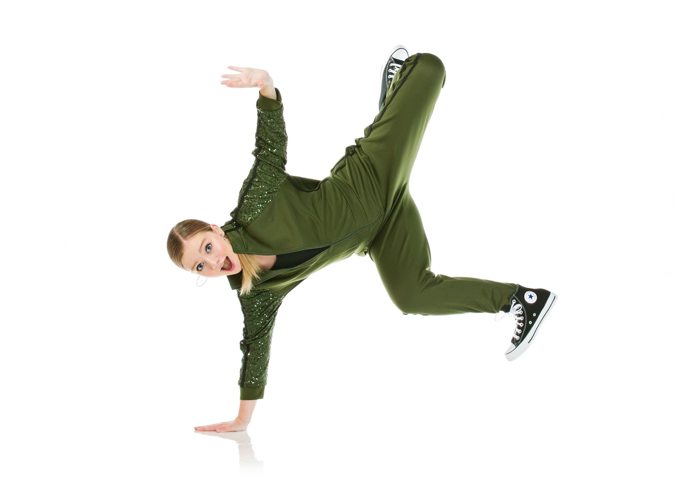 Hip-hop dancer moving in studio light