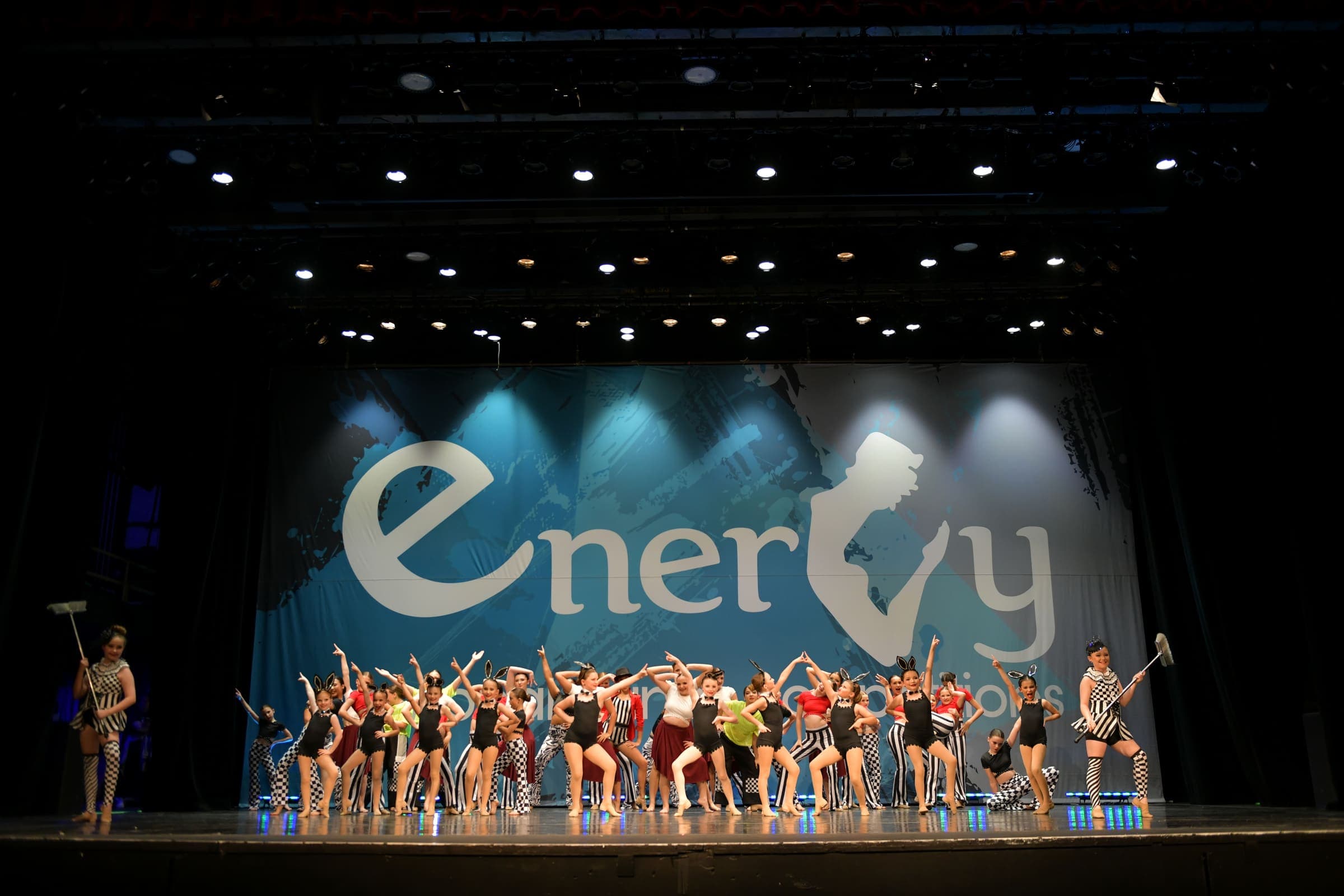 Competitive team dancers posing in costume