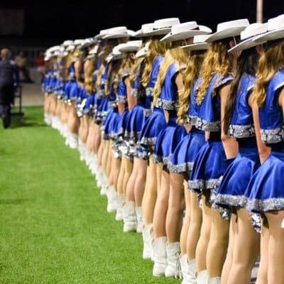 School drill team dancers performing with pom poms